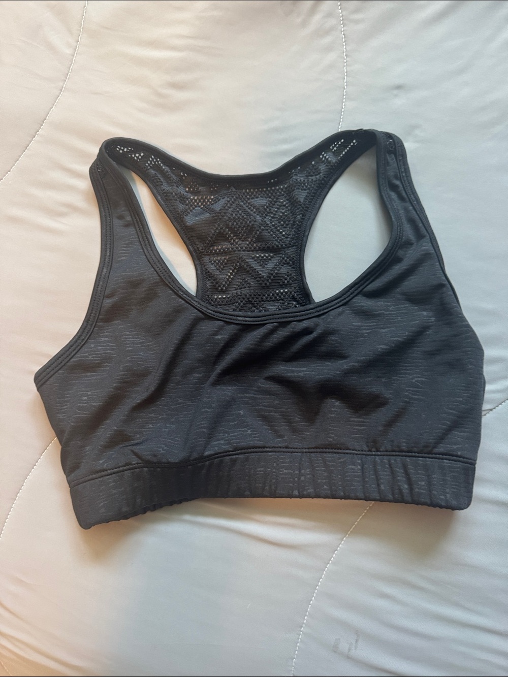 ZYIA Black Racerback Sports Bra with Lace-Style Back Panel doesn’t have pads